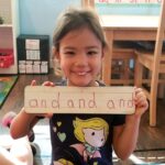 Girl Holding a Sign